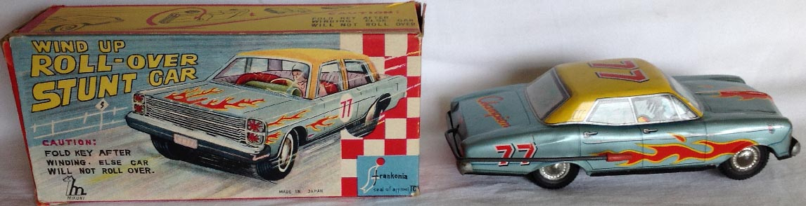 1950's boxed tinplate Japanese Mikuni Roll Over Stunt Car clock work wind up toy